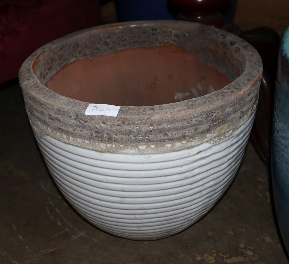 A large white glazed ribbed garden planter, 47cm diameter